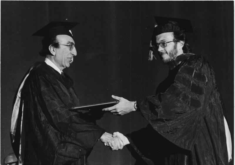 Debakey giving Roy his MD diploma